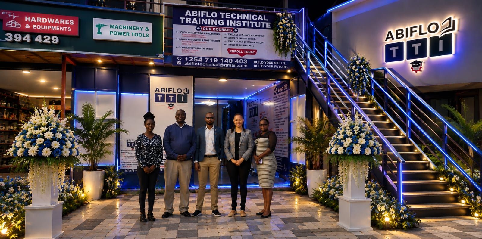 Campus entrance and institute team on the evening of the Grand Opening