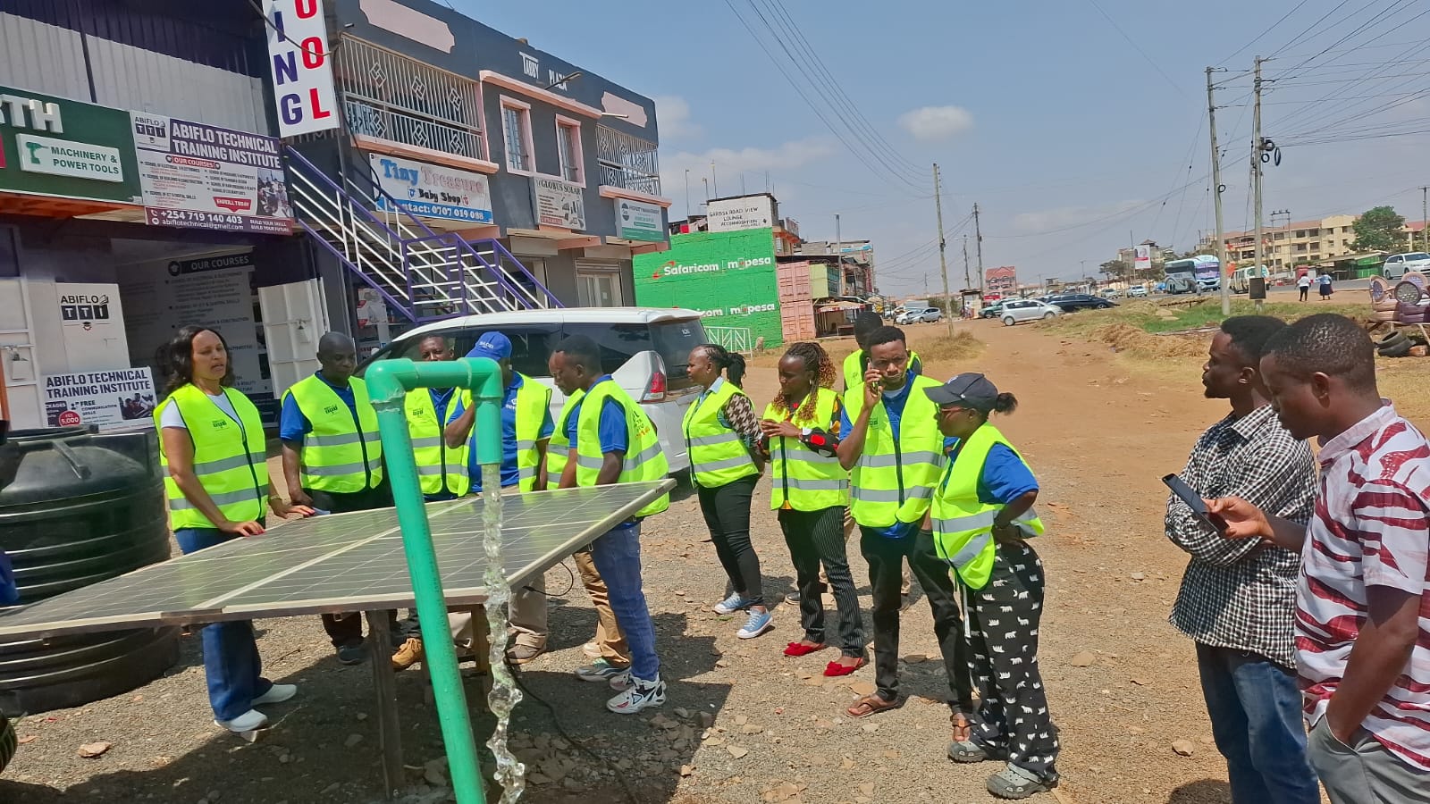 Trainees at an outdoor solar PV practical demonstration
